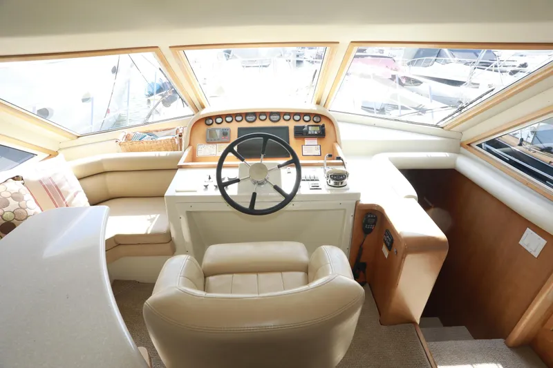 Ecto Boyz Yacht Photos Pics 2005 Navigator 53 Classic yacht helm with leather seating and panoramic windows.