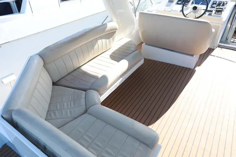 Ecto Boyz Yacht Photos Pics Luxurious seating area on 2005 Navigator 53 Classic yacht with wooden deck.