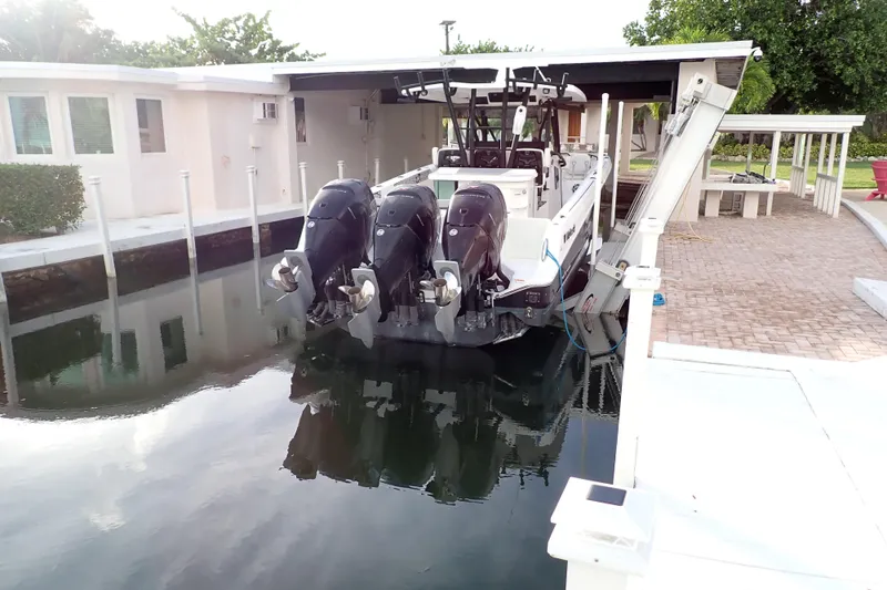  Yacht Photos Pics 2019 Wellcraft 352 Fisherman boat docked with triple outboard engines.