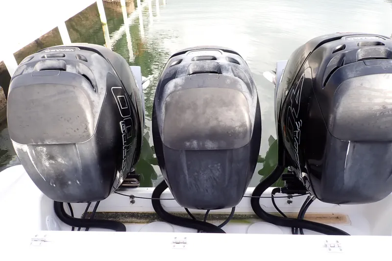  Yacht Photos Pics Three powerful outboard motors on a 2019 Wellcraft 352 Fisherman boat.