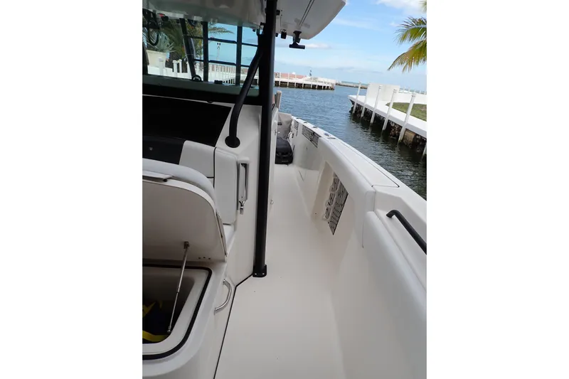  Yacht Photos Pics 2019 Wellcraft 352 Fisherman boat interior with open storage, dockside view.