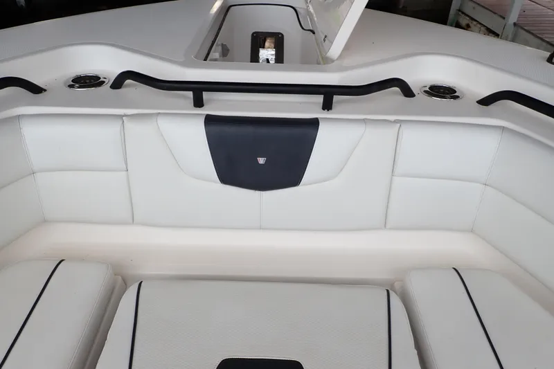  Yacht Photos Pics 2019 Wellcraft 352 Fisherman boat interior with white cushioned seating and black accents.