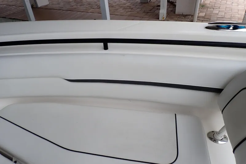  Yacht Photos Pics 2019 Wellcraft 352 Fisherman boat interior with white seating and black trim.