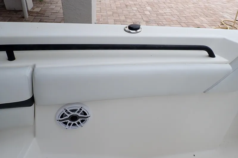  Yacht Photos Pics 2019 Wellcraft 352 Fisherman boat interior with speaker and cushioned seating.