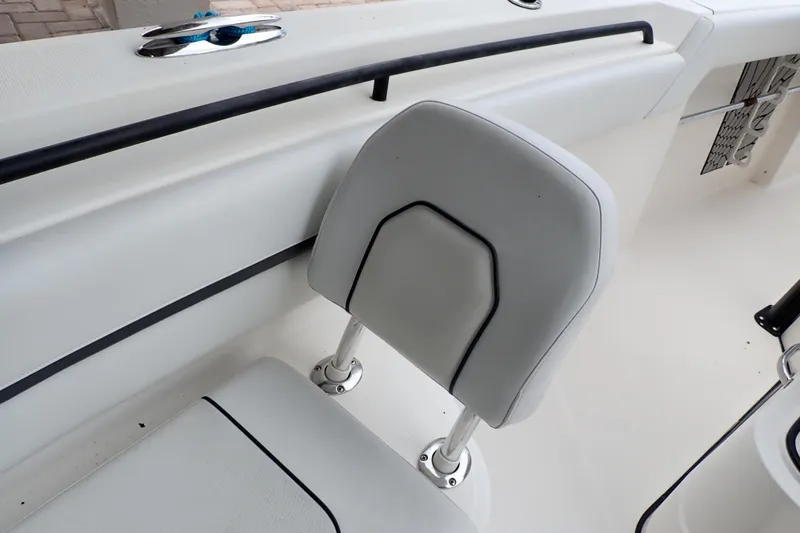  Yacht Photos Pics 2019 Wellcraft 352 Fisherman boat seat with white upholstery and sleek design.