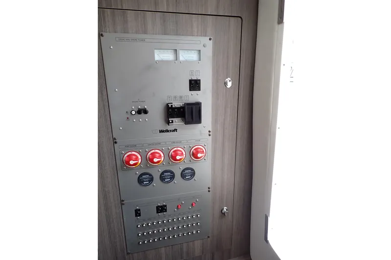  Yacht Photos Pics Electrical control panel of 2019 Wellcraft 352 Fisherman boat, featuring switches and gauges.