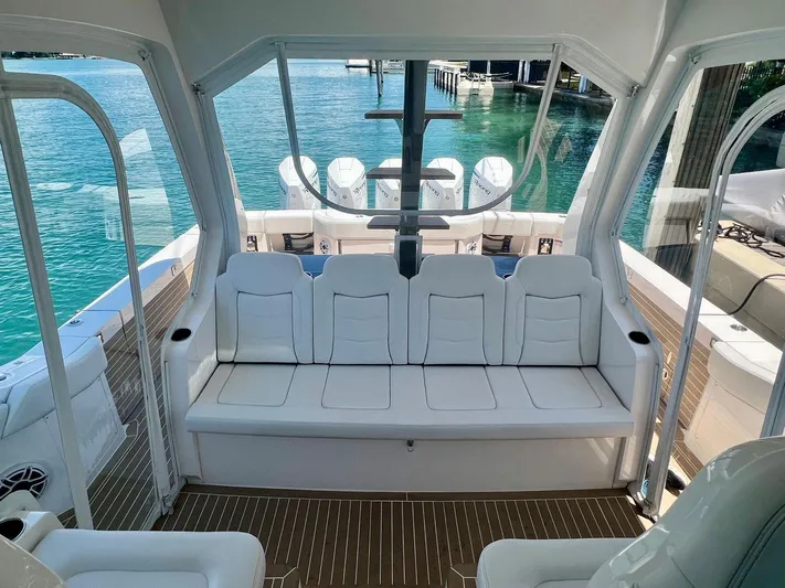 Scout 530 Lxf Yacht Photos Pics 2021 Scout 530 LXF boat interior with white seating and clear ocean view.