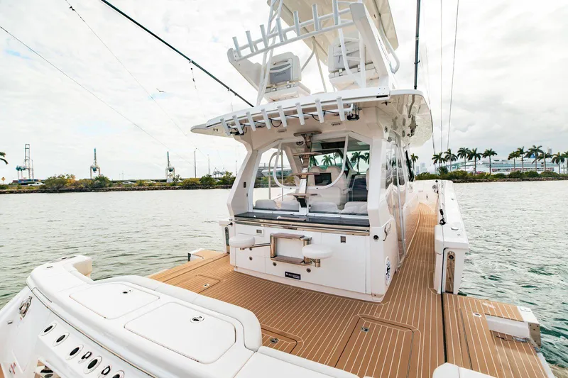 Scout 530 Lxf Yacht Photos Pics 2021 Scout 530 LXF luxury boat with spacious deck and modern design on calm water.