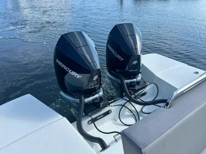  Yacht Photos Pics 2024 Beneteau Flyer 10 with twin Mercury outboard engines on water.