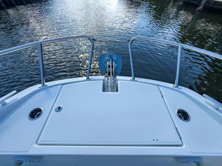  Yacht Photos Pics 2024 Beneteau Flyer 10 boat deck with stainless steel railings on calm water.