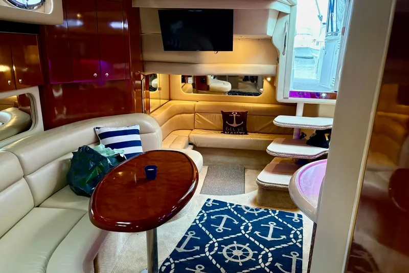  Yacht Photos Pics Luxurious interior of 2003 Sea Ray 380 Sundancer yacht with elegant seating and nautical decor.