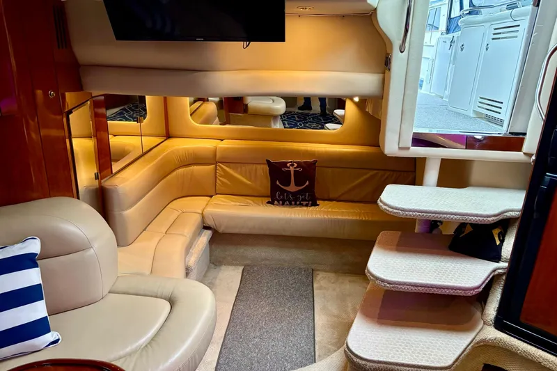  Yacht Photos Pics Luxurious interior of 2003 Sea Ray 380 Sundancer yacht with plush seating and nautical decor.