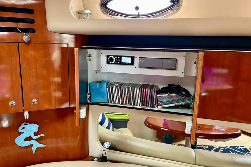  Yacht Photos Pics Interior of 2003 Sea Ray 380 Sundancer with wooden cabinets and entertainment system.