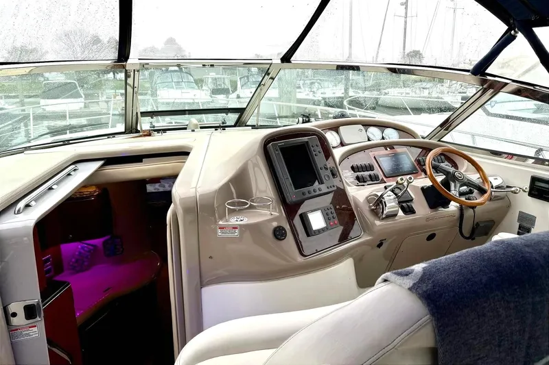  Yacht Photos Pics 2003 Sea Ray 380 Sundancer helm with navigation controls and steering wheel.