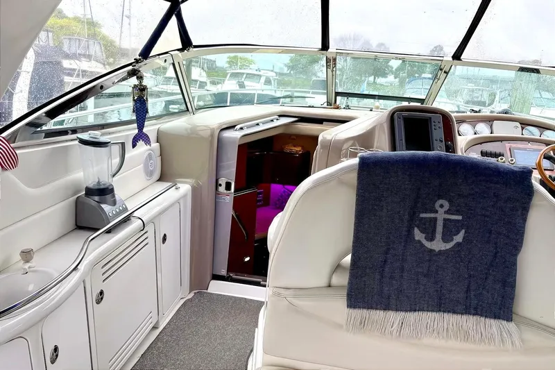  Yacht Photos Pics 2003 Sea Ray 380 Sundancer cockpit with blender, anchor blanket, and helm view.