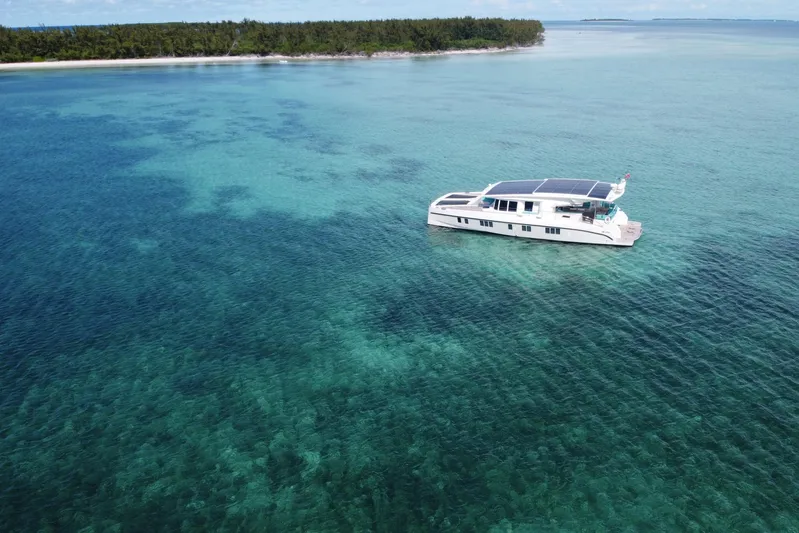 Firefly Yacht Photos Pics Luxurious Serenity 64 yacht cruising in clear turquoise waters, 2018 model.