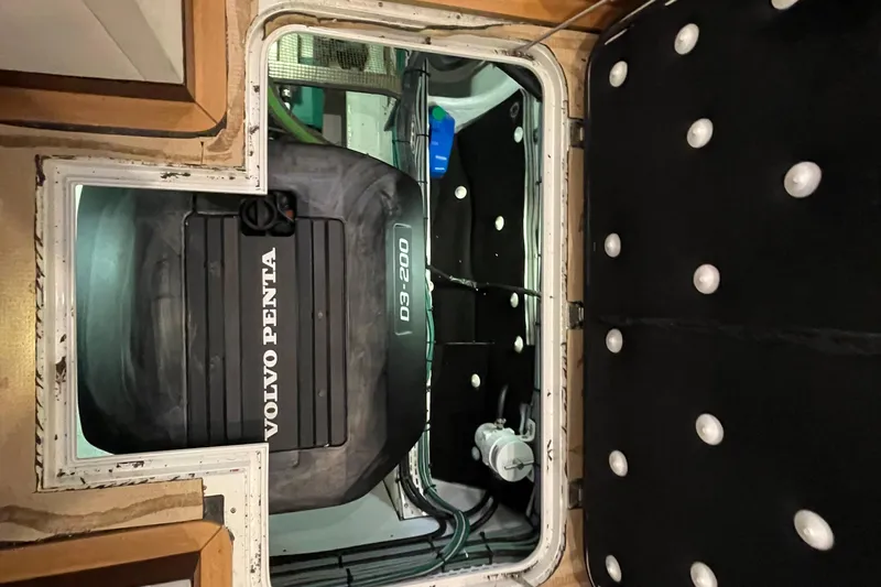 Firefly Yacht Photos Pics Engine compartment of a 2018 Serenity 64 yacht featuring a Volvo Penta D3-200 engine.