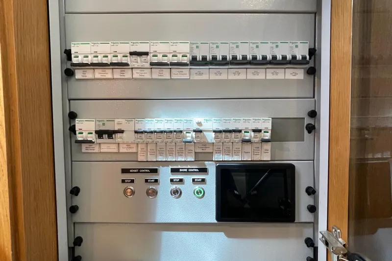 Firefly Yacht Photos Pics Electrical control panel with circuit breakers and control buttons, Serenity 64 model, 2018.