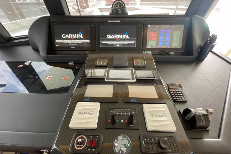 Firefly Yacht Photos Pics Control panel of a 2018 Serenity 64 yacht with Garmin navigation systems.
