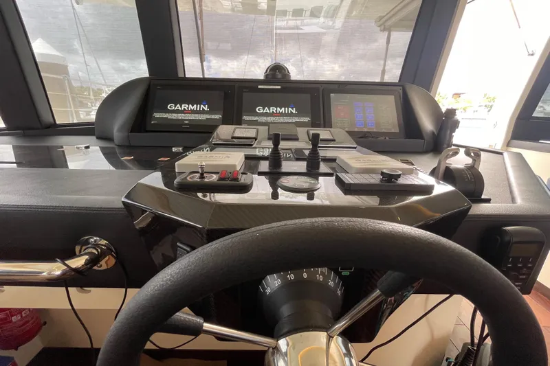Firefly Yacht Photos Pics Cockpit of 2018 Serenity 64 yacht with Garmin navigation displays and controls.