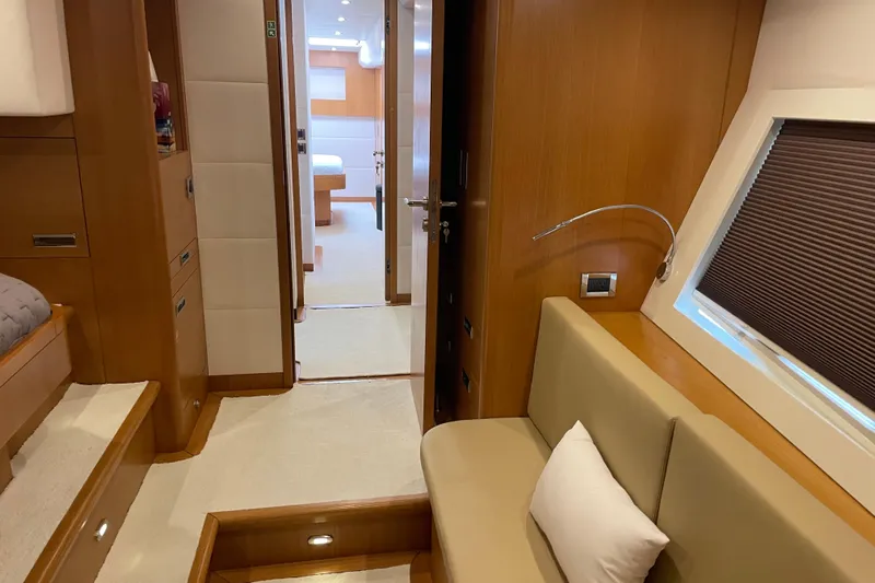 Firefly Yacht Photos Pics Luxurious interior of 2018 Serenity 64 yacht with modern furnishings and cozy seating.