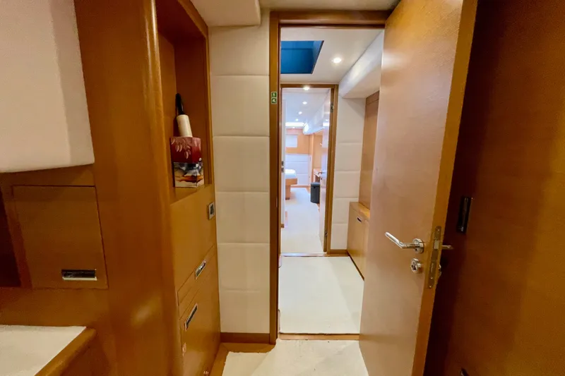 Firefly Yacht Photos Pics Interior view of 2018 Serenity 64 yacht, featuring wooden cabinetry and modern design.