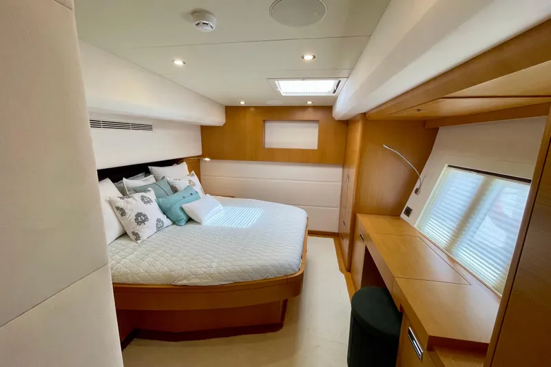 Firefly Yacht Photos Pics Luxurious bedroom interior of 2018 Serenity 64 yacht with modern design and cozy bedding.