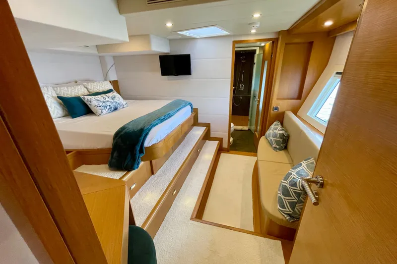 Firefly Yacht Photos Pics Luxurious Serenity 64 yacht bedroom interior, featuring elegant bedding and modern design, 2018 model.