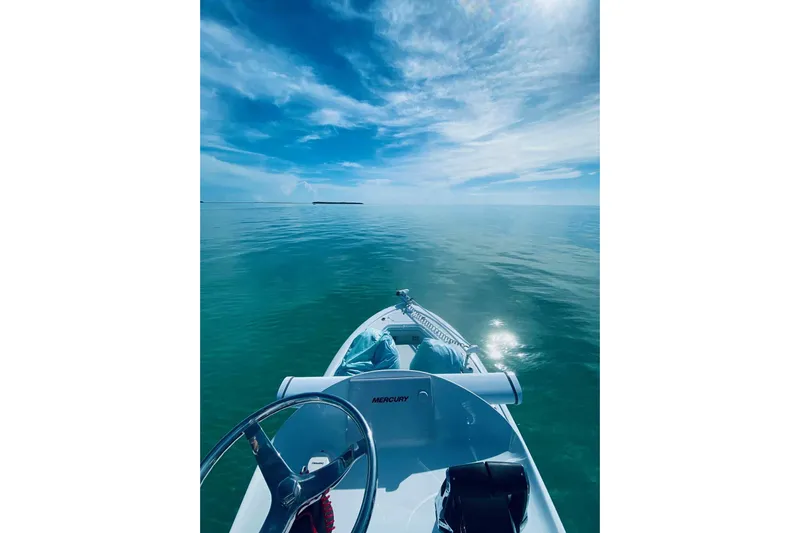 El Viaje Yacht Photos Pics 2023 Andros Offshore 32 boat on calm ocean under blue sky.