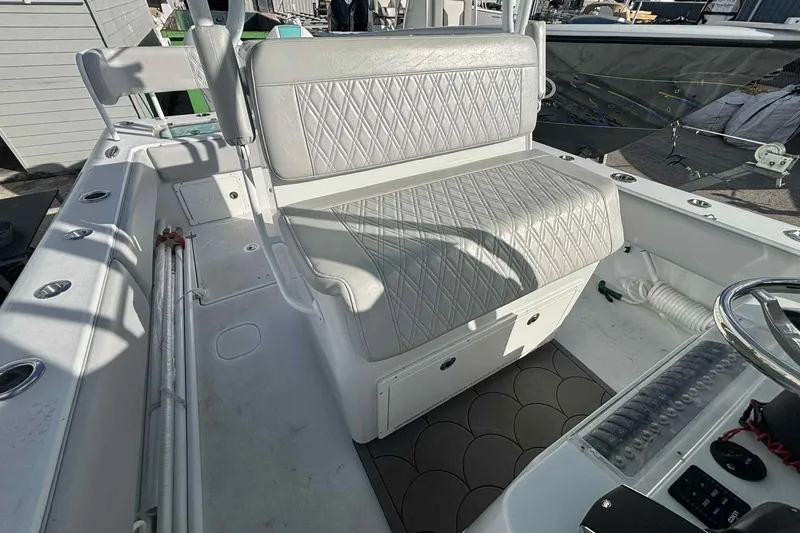 El Viaje Yacht Photos Pics 2023 Andros Offshore 32 boat interior with cushioned seating and steering console.