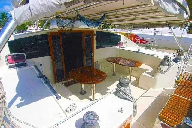 Scout Yacht Photos Pics Cockpit of 1992 Privilege 482 yacht with wooden tables and seating area.