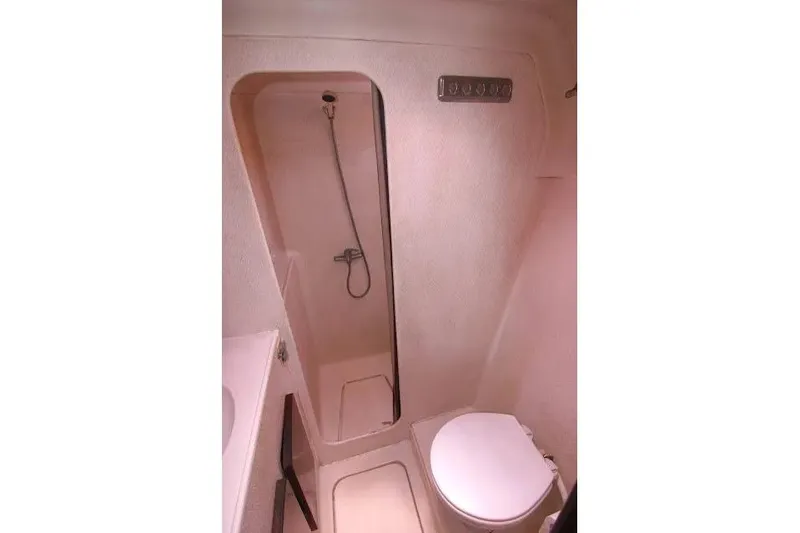 Scout Yacht Photos Pics Compact bathroom in a 1992 Privilege 482 yacht, featuring a shower and toilet.