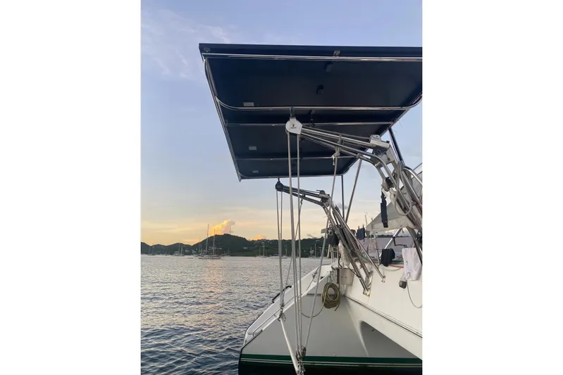 Scout Yacht Photos Pics Sailboat Privilege 482, 1992 model, docked at sunset with scenic water view.