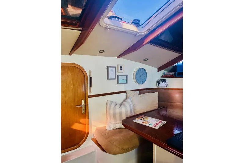 Scout Yacht Photos Pics Cozy interior of 1992 Privilege 482 yacht with wooden accents and seating area.