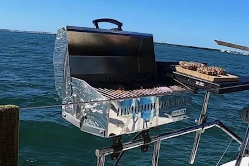 Scout Yacht Photos Pics Barbecue grill on a Privilege 482 yacht, 1992, with ocean backdrop.