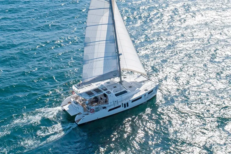 Lost Abbey Yacht Photos Pics 2021 Royal Cape Catamarans Majestic sailing on sparkling blue ocean waters.