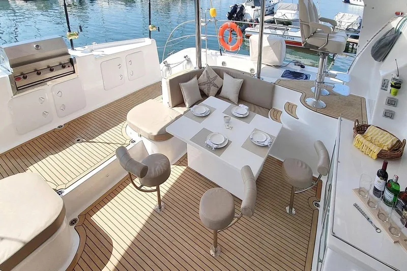 Lost Abbey Yacht Photos Pics Luxurious 2021 Royal Cape Catamarans Majestic yacht interior with elegant dining area and modern amenities.