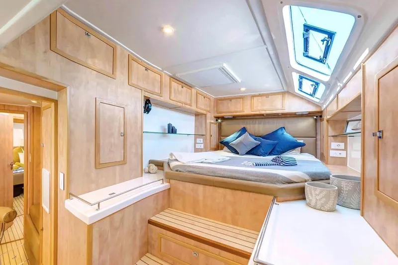 Lost Abbey Yacht Photos Pics Luxurious 2021 Royal Cape Catamarans Majestic cabin interior with skylights and modern decor.