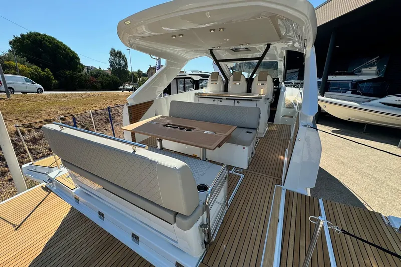  Yacht Photos Pics 2026 Jeanneau DB/37 IB luxury yacht with spacious seating and elegant wood decking.