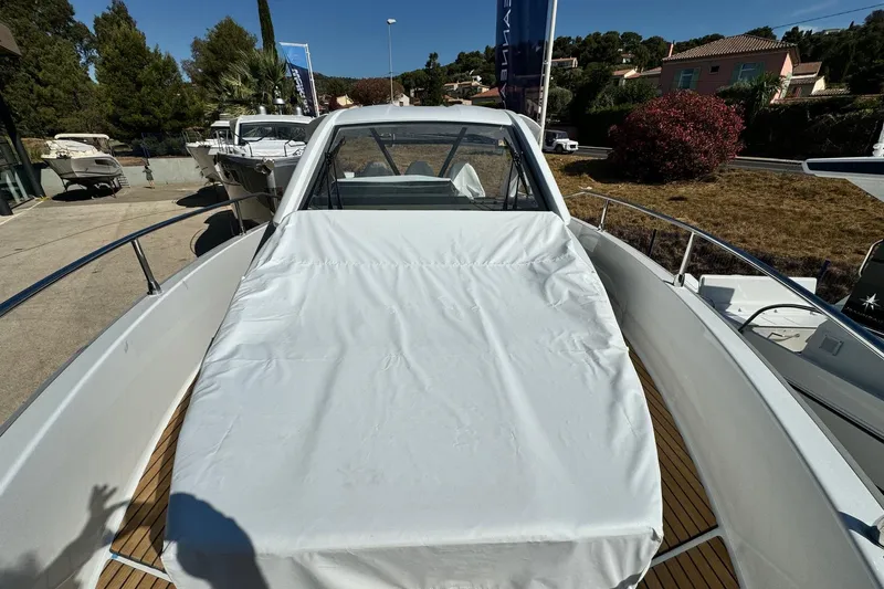  Yacht Photos Pics 2026 Jeanneau DB/37 IB boat with covered deck, docked outdoors.