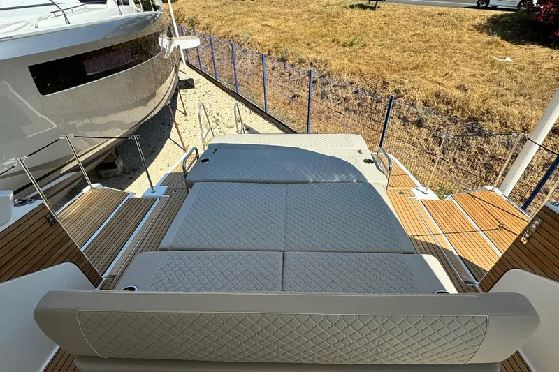  Yacht Photos Pics 2026 Jeanneau DB/37 IB boat with luxurious deck seating and elegant design.