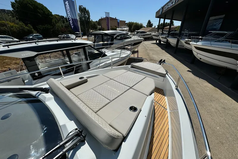  Yacht Photos Pics 2026 Jeanneau DB/37 IB boat with sleek design and spacious deck at a marina.