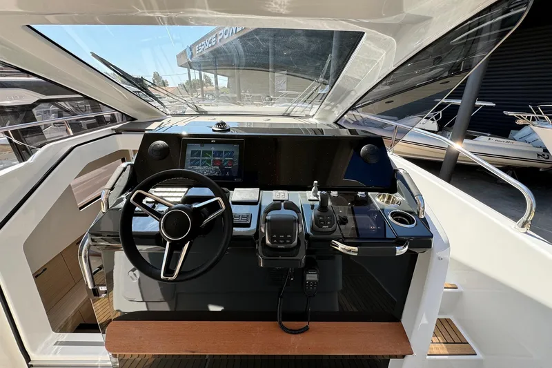  Yacht Photos Pics Helm of 2026 Jeanneau DB/37 IB boat with modern controls and navigation system.