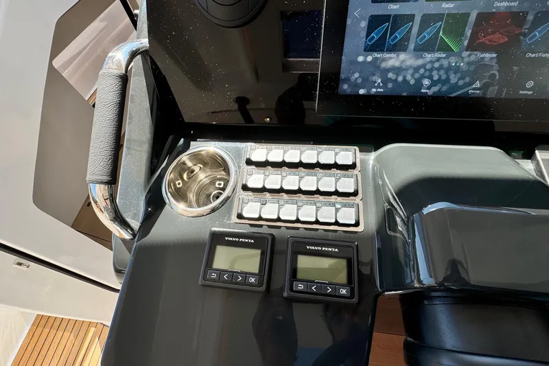  Yacht Photos Pics Control panel of 2026 Jeanneau DB/37 IB boat with digital displays and buttons.