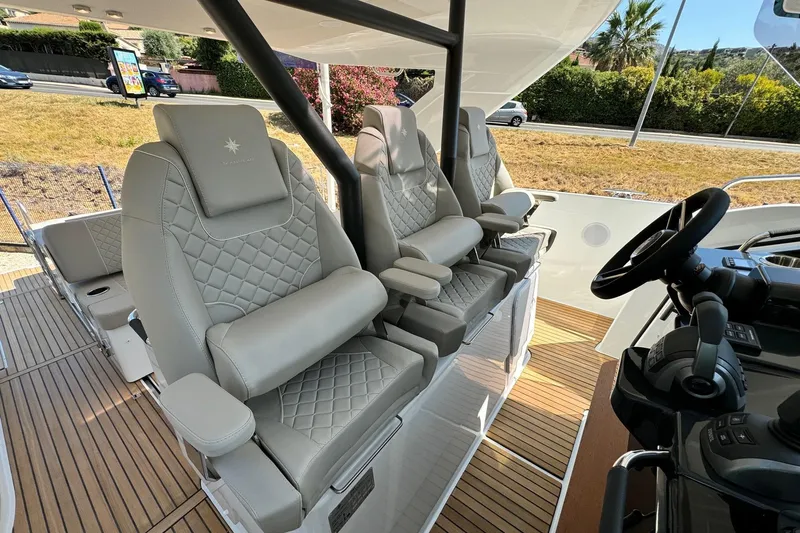  Yacht Photos Pics Luxurious seating on 2026 Jeanneau DB/37 IB boat with elegant design and modern controls.