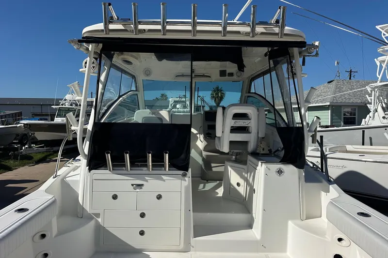  Yacht Photos Pics 2012 Boston Whaler 315 Conquest boat interior with seating and storage compartments.