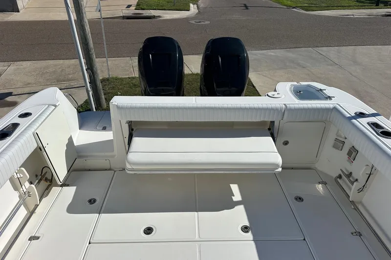  Yacht Photos Pics 2012 Boston Whaler 315 Conquest boat deck with seating and dual engines.