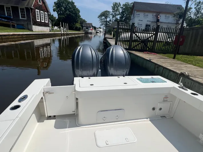  Yacht Photos Pics 2023 Parker 2801 Center Console boat docked in a serene canal setting.