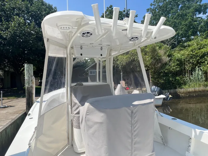  Yacht Photos Pics 2023 Parker 2801 Center Console boat docked, featuring rod holders and covered seating.