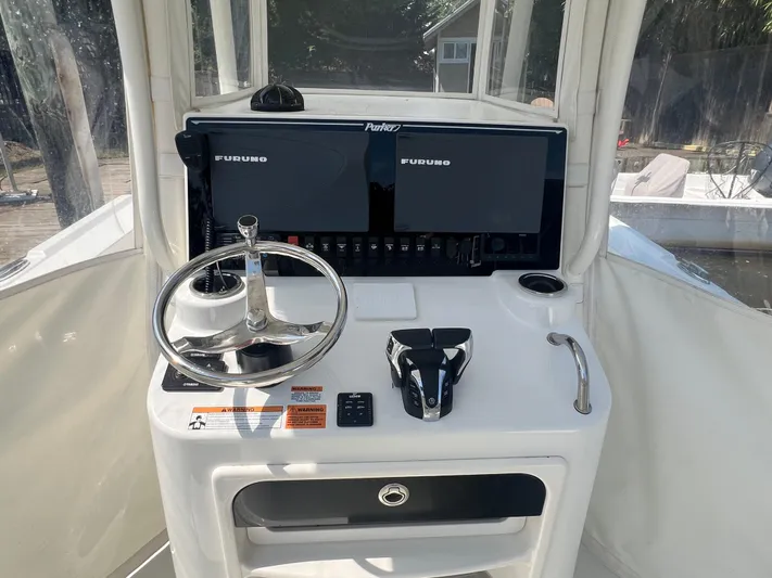  Yacht Photos Pics 2023 Parker 2801 Center Console boat dashboard with steering wheel and Furuno displays.